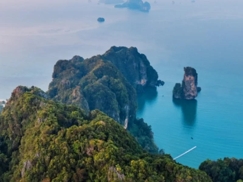 summer-view-of-rocky-mountains-and-sea-in-a-tropic.webp